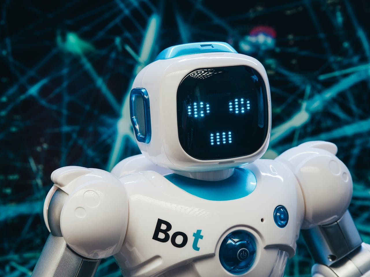 about-01 Close-up of a futuristic humanoid robot with a digital face display, representing modern technology.